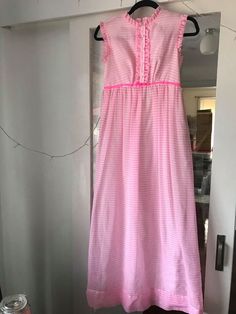 Bright pink and white striped circa 1960s dress. Price includes shipping Has a fitted top and empire waist skirt. Zipped up back, zip is in great condition. It is fully lined, but please keep in mind that the skirt lining is fitted, so even though the style is flowy, it actually isn't underneath! Brand tag is Jeanne deCampo of Melbourne Measurements were taken flat, please double for approximate. Best sit a size 8 I think B: 41 W: (very high waist, think ribcage) 34cm H: 47cm Vintage Striped Sleeveless Dress, Retro Striped Lined Dress, Vintage Striped Dresses For Daywear, 60s Vintage Dress, Vintage Striped Dress, Pretty In Pink Dress, Vintage Pink Dress, Skirt Lining, Vintage Dress 60s