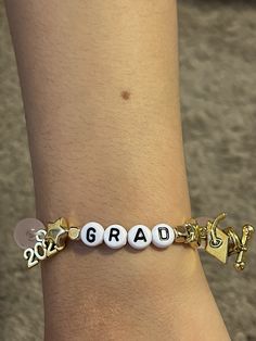 Custom Graduation bracelets; please see photos for custom colors and bead. Please leave in notes what you would like put together. You can add whatever you would like to bracelets such as name; name of school, initials. Hoco Bracelets, Customizable Adjustable Jewelry For School, Adjustable White Bracelets For School, Personalized Adjustable Bracelets For Graduation, Personalized Adjustable Bracelets For Graduation Gift, Graduation Bracelet Ideas, Diy Decoracion, Graduation Bracelet, Graduation Jewelry