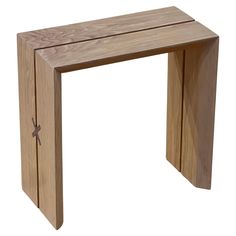 a small wooden table with a cross on the top and bottom section, made out of wood