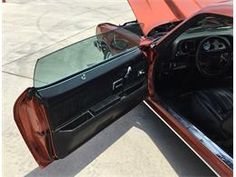 the interior of a car with its door open