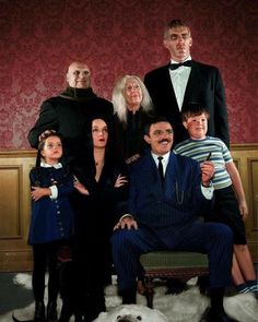 a group of people dressed up as the addams