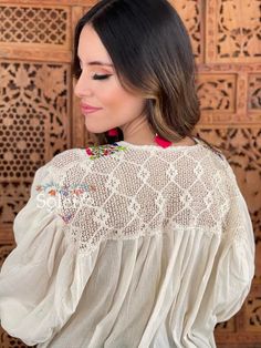 This Mexican Traditional Blouse has beautiful embroidered flowers that are hand embroidered in the San Antonino Style. This beautiful loose fitting blouse gives you both style and comfort. The front and upper back have a beautiful lace design. The blouse is made in Mexico by Artisan Hands made with love for you. This blouse comes one size which is ideal for sizes S,M and L. Shop the hand painted earrings modeled here: https://www.etsy.com/es/listing/802949597/aretes-artesanales-pintado-a-mano-ar Hand Embroidered Blouse, Mexican Blouse, Hand Painted Earrings, Balloon Sleeve Top, Painted Earrings, Beautiful Blouses, Green Blouse, Lace Design, Embroidered Blouse