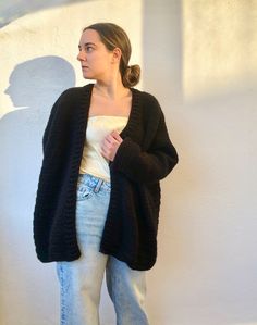 Cozy Black V-neck Sweater Coat, Cozy Long Black Cardigan, Black Chunky Knit Sweater Coat, Black Open Front Cozy Sweater Coat, Black Cozy Open Front Sweater Coat, Black Open Front Knit Cardigan, Cozy Black Open Front Sweater, Black Knitted Cardigan For Fall, Cozy Black Chunky Knit Cardigan