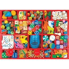 a red tray filled with lots of different types of toys and magnets on top of each other