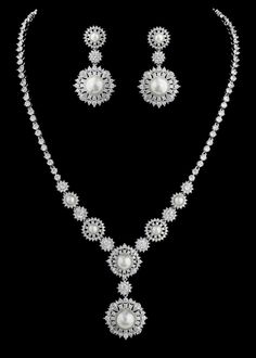 Pearl and CZ Bridal Jewelry Set This exquisite rhodium silver plated vintage inspired  jewelry set will dazzle on your wedding day. It features AAA quality round and pear cut cz crystals as well as lustrous diamond white glass pearls in a unique vintage inspired design.  This glamorous jewelry set will be a memorable part of your wedding day or any special occasion.Size: Necklace - 16" Long with a 1 3/4" long drop.  Pierced Earrings are about 1 1/2" long.Color: Silver/Diamond white/Clear.Style: Vintage Diamond Necklace, Winter Wedding Accessories, Diamond Necklace Wedding, Crystal Bridal Jewelry Sets, Glamorous Jewelry, Bridal Jewelry Set, Bridal Fashion Jewelry, Vintage Inspired Jewelry, Swarovski Beads