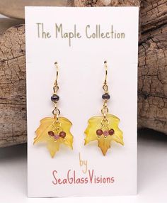 While my jewelry focus is sea glass when I saw these beautiful Maple leaf charms I knew I had to create with them. Fall has always been my favorite time of year and these Maple leaves remind me of my very favorite place, Vermont. These will be a seasonal offering. These Maple leaf charms are lightweight and have beautiful shaded coloring. I created these earrings with gold plated French ear wires and findings and also added tiny gemstone beads of Watermelon Tourmaline and Amethyst and glass accent beads. The pictures really don't do justice to the beautiful shading on each of these hand painted leaf charms. These lightweight earrings hang 1 3/4 inches long and come with clear rubber safety backs. Jewelry care tips - Keep metals dry and free of lotions, creams and hair products. Store jewel Amber Colored Nickel Free Czech Glass Jewelry, Handmade Czech Glass Jewelry For Everyday, Handmade Everyday Czech Glass Jewelry, Handmade Czech Glass Everyday Jewelry, Hypoallergenic Leaf-shaped Jewelry Gift, Handmade Leaf-shaped Everyday Jewelry, Handmade Everyday Leaf-shaped Jewelry, Everyday Handmade Leaf-shaped Jewelry, Fall Leaf Silver Earrings