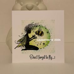 a card with a fairy holding a bee on it's back and saying, don't forget to fly