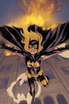 the batgirl is flying through the air in front of a building with flames coming from it