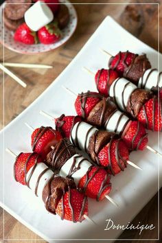 chocolate covered strawberries on skewers with marshmallows