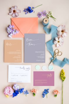 the wedding stationery is laid out and ready to be put into their guests'envelopes