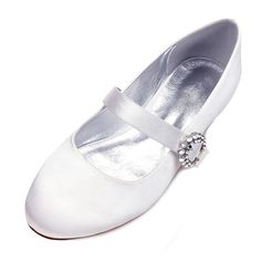 a pair of white shoes with a jewel buckle