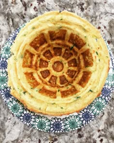 a blue and white plate with some food on it