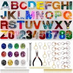 the letters and numbers are made up of different types of sequins, beads, scissors, wire, and other items