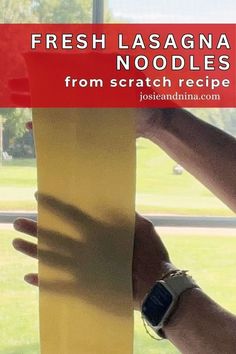 a person holding up a yellow object with the words fresh lasagna noodles from scratch recipe