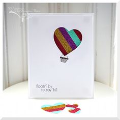 a card with an image of a hot air balloon in the shape of a heart