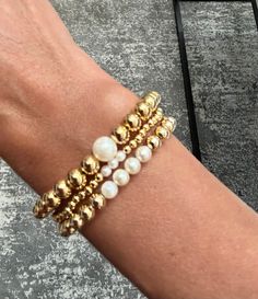 Set of 3 gold filled bracelets with cultured mother of pearl beads⭐️Different sizes available and all come with a 2" extender⭐️The perfect classic stack 🤍 Set includes: 🤍3mm bracelet  🤍5mm bracelet  🤍6mm bracelet Elegant Hypoallergenic Gold Stretch Bracelet, Classic Gold Pearl Bracelet Hypoallergenic, Elegant Adjustable 14k Gold-filled Beaded Bracelet, Elegant 14k Gold-filled Stretch Bracelet, Elegant Gold Beaded Bracelets For Layering, Elegant Stackable Beaded Bracelets In 14k Gold, Adjustable Elegant Stretch Bracelet In 14k Gold, Elegant Adjustable 14k Gold Filled Stretch Bracelet, Elegant Gold Stretch Bracelet For Layering