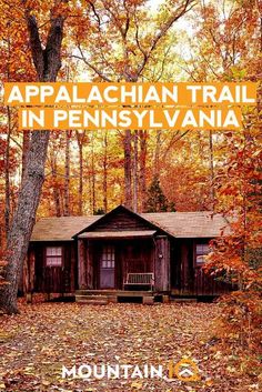 a cabin in the woods with fall leaves on the ground and text overlay reads, appalachan trail in pennsylvania