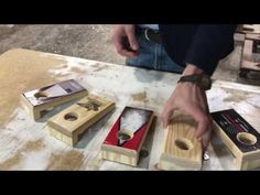 a man is making wooden boxes with tools