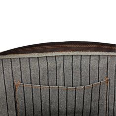 the back pocket of a gray and black striped bag