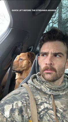 a man and his dog sitting in the back seat of a car