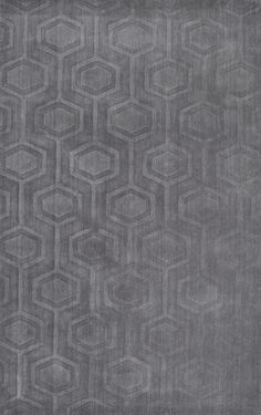 an area rug with hexagonal shapes on it