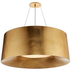 a large light fixture hanging from the ceiling with a circular shade on it's side