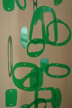 some green objects are hanging on the wall