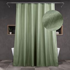 a green shower curtain hanging from a metal rod