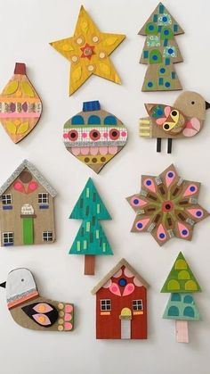 a group of wooden ornaments sitting on top of a white surface