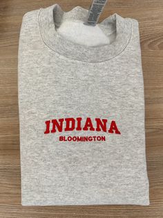 If you want a custom order or have any questions, please message me! -Bloomington Indiana embroidered crewneck -50/50 cotton/polyester -Unisex sizing: fits true to size. Order one size up for a looser fit. College Crew T-shirt With Embroidered Text, Custom Embroidered Crew T-shirt For College, Custom Embroidery Crew T-shirt For College, College Crew T-shirt With Custom Embroidery, Custom Embroidery Crew Neck T-shirt For College, Bloomington Indiana, College Kids, Embroidered Crewneck, 50 50