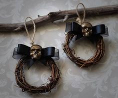 two wreaths with skulls hanging from them