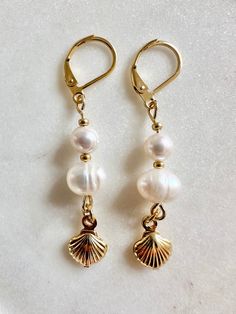 Grade A freshwater pearl and tiny shell charm drop earrings on 24k gold plated/ 24k gold vermeil leverback hooks drop length approximately - 4.5cm Choose from gold plated and gold vermeil hooks: Gold plated - stainless steel plated with 24k gold, plating thickness 0.5 microns Gold vermeil - sterling silver plated with 24k thicker layer of gold, 3 microns thick Keep away from water. Avoid direct contact with perfumes and chemicals. Remove before showering or swimming. Sailboat Wedding, Earrings Dainty, Pearl Shell, Gold Plated Earrings, Summer Jewelry, Gold Plating, Summer Wardrobe, Gold Vermeil, Freshwater Pearls