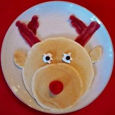 four different pictures with pancakes, strawberries, bacon and other foods in the shape of reindeers