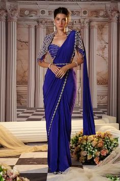 Purple pre-draped saree with sequins, beads embroidery in placement pattern. Paired with a padded blouse with elevated sleeves and floret motif, linear sequin embroidery. Comes along with embroidered belt. - Aza Fashions Traditional Fitted Lehenga With Draped Sleeves, Draped Traditional Wear For Diwali, Fitted Georgette Dupatta With Draped Sleeves, Bollywood Fitted Blouse With Draped Sleeves, Bollywood Style Fitted Blouse With Draped Sleeves, Fitted Pre-draped Saree With Sheer Dupatta, Traditional Fitted Dupatta With Draped Sleeves, Festive Saree With Draped Sleeves, Bollywood Style Saree With Draped Sleeves For Diwali