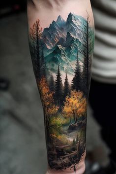 a man's arm with an image of mountains and trees in the forest on it