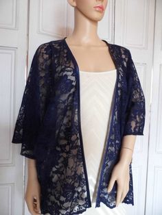 This is a beautiful hand made lace kimono ideal as a cover-up for weddings or special occasions. It has a satin edging. It can be made in any size from 8 to 24 (UK sizes). It is made in the UK. It is normally sent out to you within 5 days, but I am very happy to make your order a priority if you need it urgently. Just let me know the date needed by. Postage is free in the UK! International postage is £9. I am happy to exchange items or refund your payment if you are less than happy with the prod Elegant Long Kimono With Lace Trim, Elegant Long Lace Trim Kimono, Elegant Long Lace Kimono, Lace Wedding Kimono With Kimono Sleeves, Elegant Sheer Party Kimono, Fitted Open Front Kimono For Parties, Wedding Lace Kimono With Lace Trim, Elegant Fitted Open Front Kimono, Evening Shrug With Lace Trim