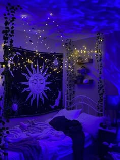 a bed room with a large tapestry on the wall and purple lights hanging from the ceiling