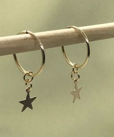 14k U.S.A Gold filled Endless Hoop Earrings with removable Star charms You can wear them with the Star charms or just the plain hoop earrings.   Dainty and simple that goes with any outfit. Materials: 14k U.S.A Gold filled Hoop Earrings and star charms This pair of earrings is Made to Order.  Measurement: 16 mm Hoop Earrings and 8mm Star charms Earrings CANNOT be RETURNED due to hygienic reason.   Great as birthday,anniversary,  holiday, graduation, Valentine, Mother's Day gift! ♥ IMPORTANT: Usually jewelry in the pictures looks bigger than in reality. Please consider all given dimension and compare them to the ruler before ordering. . *WHAT IS GOLD FILLED? It's an actual layer of gold-pressure bonded to another metal. Gold filled is not to be confused with gold plating as filled literally Ear Huggies, Star Hoop Earrings, Gold Star Earrings, Earrings Gold Hoop, Celestial Earrings, Earrings Star, Gold Filled Hoops, Hoop Earrings Gold, Earrings Ear