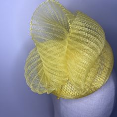 Add a touch of sophistication to your summer outfit with this vibrant yellow tone pillbox hat 16cms in diameter, featuring a pleated crin design. 🖤 Perfect for special occasions, this elegant hat will elevate your style and make a bold fashion statement. 🖤Shipped in a sturdy (keepsake) box and packed with special love and care.  🖤Made in the UK - customised fascinator orders are welcome. Please send me a message and we can create something unique.  Terms & Conditions I hope you love your purchase however I gladly accept returns, exchanges and cancellations. Head pieces must be returned within 14 days with all tags attached for a full refund. Cancellation must be made within 2 days of purchase.  🖤Finally I would love to share in your special day so please tag or send me pictures of you Luxury Yellow Fascinator For Wedding, Gold Summer Fascinator, Adjustable Yellow Headpiece For Summer, Adjustable Yellow Summer Headpieces, Adjustable Yellow Headpieces For Summer, Adjustable Yellow Hats For Royal Ascot, Adjustable Yellow Hat For Royal Ascot, Yellow Adjustable Fascinator For Party, Adjustable Yellow Fascinator For Party