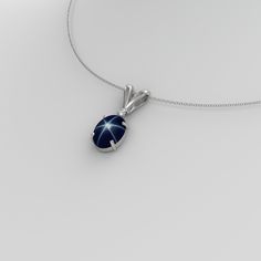 Handmade, this genuine, earth-mined blue star sapphire sterling silver 925 necklace is accented by a diamond. The star sapphire gemstone showcases a 6-ray floating star when exposed to direct sunlight. The gemstones are set in a solid sterling silver oval-shaped pendant setting. Free gift box included with purchase of this trendy, vintage-inspired pendant. Main Gemstone: Blue Star Sapphire Gemstone Size: 8 x 6 mm Gemstone Weight: ~2.3 Carats Gemstone Color: Blue (With Floating Star) Gemstone Ori Star-shaped Gemstone Jewelry For Formal Occasions, Blue Star-shaped Jewelry For Formal Occasions, Star Shaped Sapphire Jewelry For Anniversary, Formal Blue Star-shaped Jewelry, Celestial Star Sapphire Jewelry, Star Shaped Sapphire Jewelry Gift, Sterling Silver Sapphire Star Jewelry, Star Sapphire Necklace, Star Sapphire Gemstone