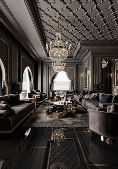 an elegant living room with chandelier and couches