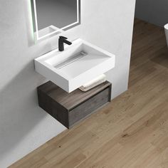 a bathroom sink sitting on top of a wooden counter