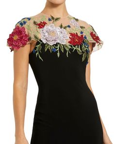 This gown features delicate floral embellishments on a figure-flattering jersey fabric. With its fitted silhouette, it exudes elegance and sophistication. Perfect for formal events or evening affairs. Mac Duggal Hand-embellished Mesh Bodice; Jersey Skirt (100% polyester) Partially lined bodice; fully lined skirt; semi-sheer unlined sleeves Round illusion high neckline Short sleeve Intricate floral detailing Concealed back zipper Approx. 62.5" from top of shoulder to bottom hem Available in Black Elegant Gown With Floral Applique For Gala, Elegant Floral Applique Gown For Gala, Formal Floor-length Evening Dress With Floral Applique, Elegant Gown With Floral Embroidery For Gala, Elegant Gala Gown With Floral Embroidery, Elegant Floral Embroidered Gown For Gala, Glamorous Formal Gown With Floral Embroidery, Fitted Floral Applique Evening Dress For Party, Sleeveless Gown With Floral Applique