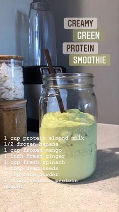 the ingredients for a green protein smoothie in a mason jar