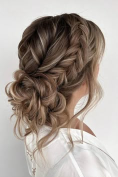 Cascading curls woven into a chic side braid, merging seamlessly into a voluminous low bun for a touch of elegance and romance. // Photo Credit: Instagram @absolutely.ineke.hairstyling Bridesmaid Hair Summer Wedding, Loose Wedding Updos For Long Hair, Bridesmaid Hairstyles For Long Hair Updo, Textured Bridal Updo, Bridal Hair Low Updo, Soft Romantic Updo, Bridget Wedding, Moh Hair, Bridesmaid Things