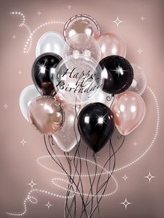 a bunch of balloons with the words happy birthday written on them in black, white and pink