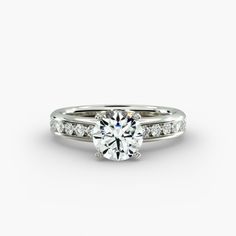 a white gold engagement ring with channel set diamonds