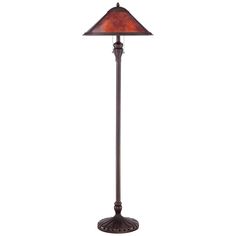 a floor lamp with a red shade on it