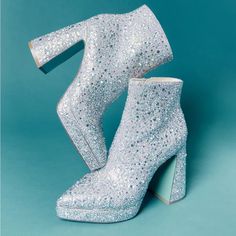 Brand New In Box Make A Statement With The Sparkly Della All-Over Rhinestone Platform Booties. These Stunning Booties Feature An All-Over Sparkly Design With A Classic Betsey Blue Bottom For A Touch Of Glam. Manmade Rhinestone Embellished Booties Synthetic Lining/Sock Betsey Blue Synthetic Sole 4 Inch Heel Height .75 Inch Platform Approx. 10 Inch Ankle Circumference Imported Style Name: Sb-Della Blue High Heel Boots With Rhinestones, Blue Party Boots With Rhinestones, Blue Rhinestone Party Boots, Blue Embellished Party Boots, Embellished Blue Party Boots, Glamorous Blue Rhinestone Boots, Glamorous Blue Round Toe Boots, Glamorous Blue Evening Boots, Blue Block Heel Party Boots