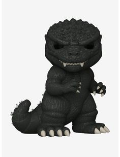 a small black godzilla toy sitting on top of a white floor